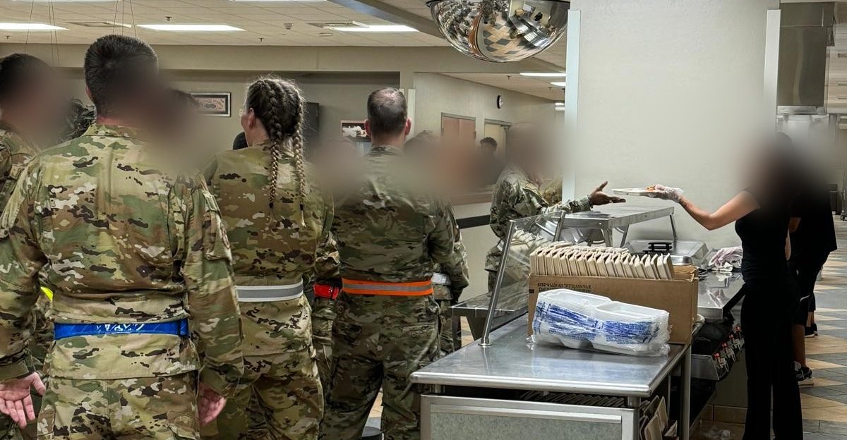 Silver National crew serving meals to soldiers on a dining-facility line